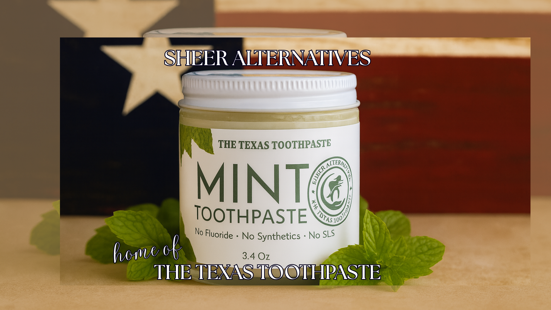 Jar of The Texas Toothpaste Mint Toothpaste with a Texas flag in the background