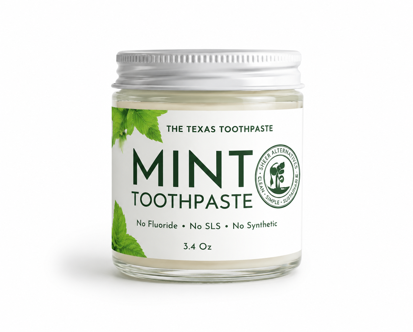 Jar of 'The Texas Toothpaste' mint toothpaste on a white background