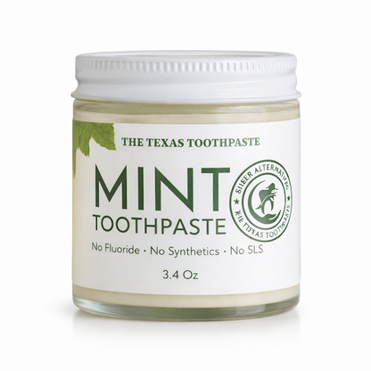 Jar of 'The Texas Toothpaste' mint toothpaste on a white background