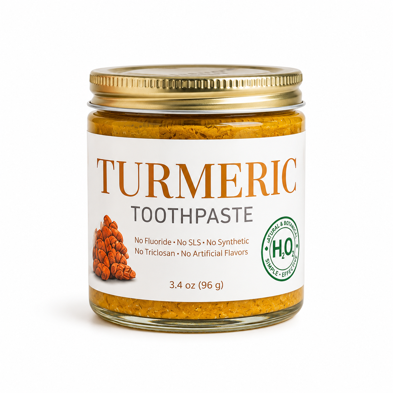 Jar of turmeric toothpaste with a gold lid on a white background